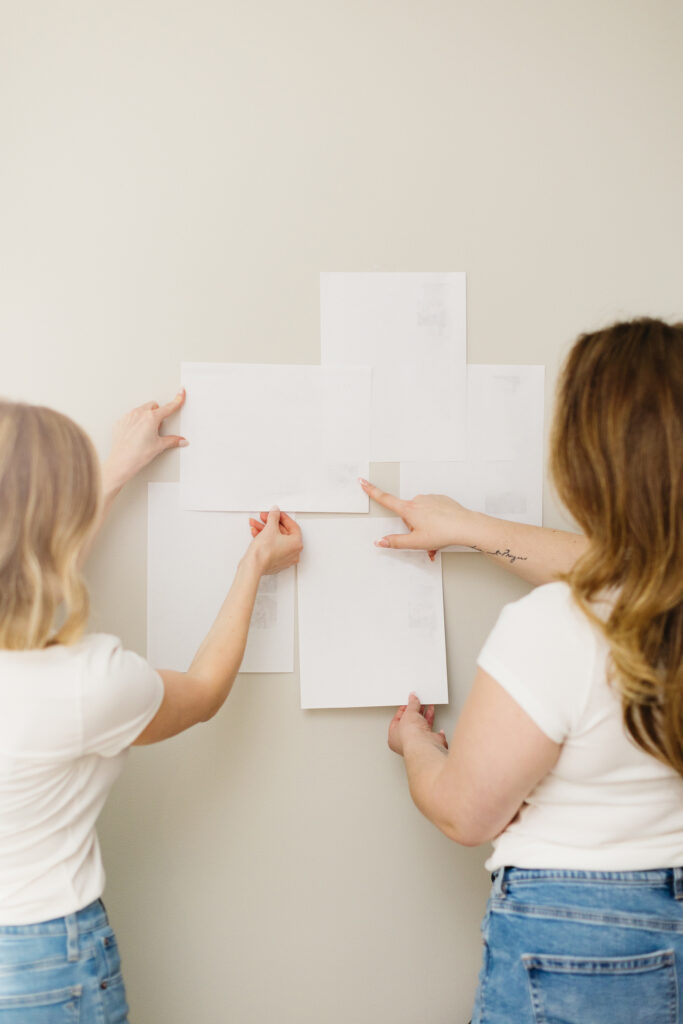 Two business owners reviewing strategy and creative direction during a brand planning session photographed by Elisabeth Eden in Fargo, North Dakota.